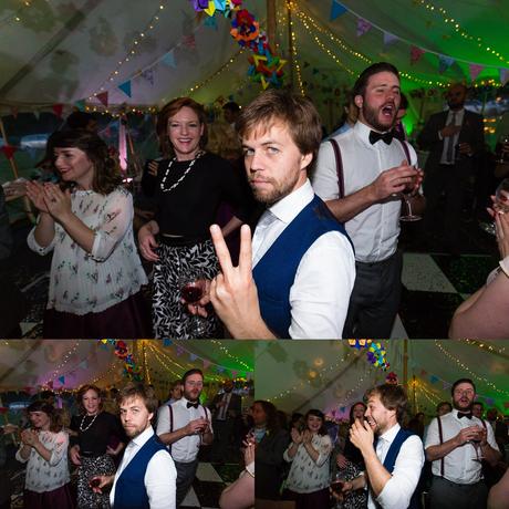 Funny groomsman makes rude gesture and laughs Derwentwater Independent Hostel Wedding