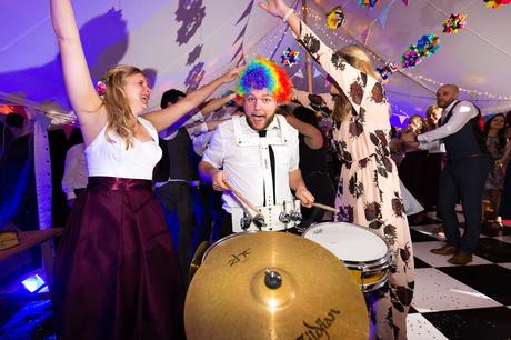 New York Brass Band drummer wearing silly wig Derwentwater Independent Hostel Wedding