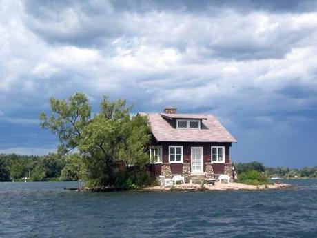 house-4-just-room-enough-island-is-one-of-the-famous-thousand-islands-that-straddle-the-us-canada-border-in-the-saint-lawrence-river-there-are-a-few-lawn-chairs-out-front-on-the-familys-tiny-beach