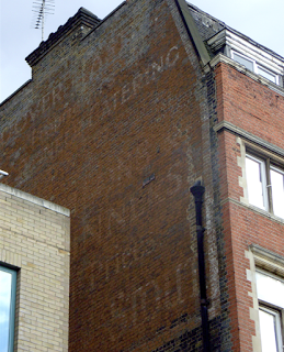 Another visit to Lower Marsh – barrows and arrowsI still think there must be an old painted ad and a lost ghostsign