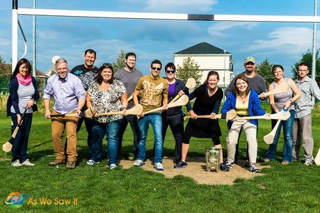 Posing with hurling sticks - We had a chance to try hurling, and it was a lot of fun!