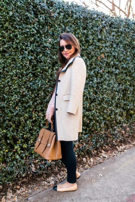 Amy Havins wears a blush sweater paired with skinny jeans and ballet flats.