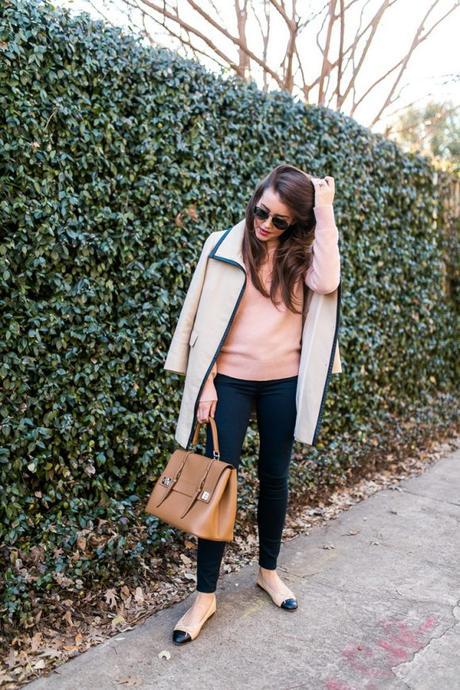 Amy Havins wears a blush sweater paired with skinny jeans and ballet flats.