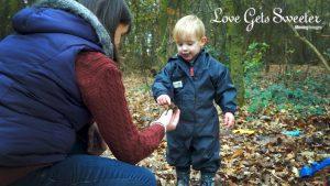 mum and 2 year old son learning about acorns for a very natural documentary style video of their family day out in lancashire
