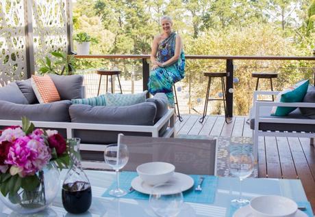Make an outdoor room feel comfortable with rugs and soft furnishings
