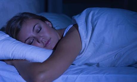 woman sleeping in dark room