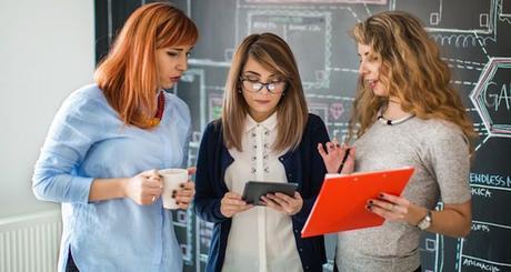 Group of young female colleagues work in the office. Creative business concept