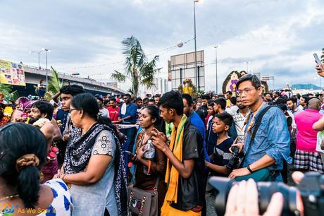 Photographer moving along with the crowd in respect of the faithful. Thaipusam 2017