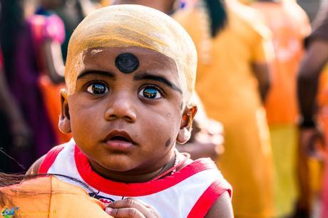Playing hide-n-go-seek with a baby to photograph Thaipusam 2017