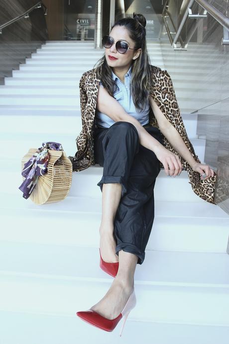 how to stay on trend without breaking your bank, h&M wide leg pants. aldo colorblock heels, spring fashion, animal print trench , half bun, blogger , cult gaia bamboo bag, street fashion, 1