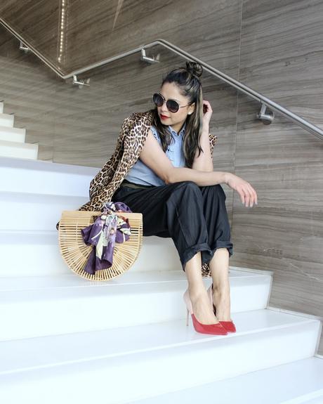 how to stay on trend without breaking your bank, h&M wide leg pants. aldo colorblock heels, spring fashion, animal print trench , half bun, blogger , cult gaia bamboo bag, street fashion, 1