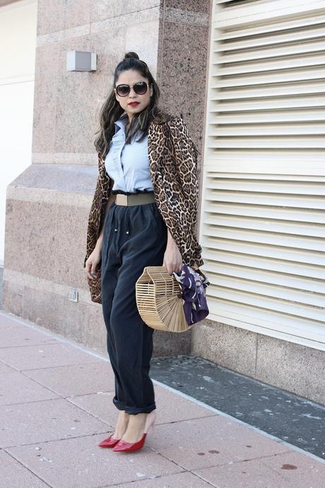 how to stay on trend without breaking your bank, h&M wide leg pants. aldo colorblock heels, spring fashion, animal print trench , half bun, blogger , cult gaia bamboo bag, street fashion, 1