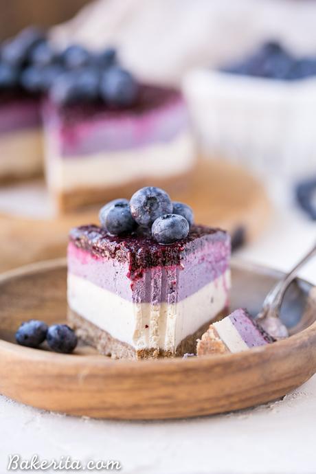 This No-Bake Layered Blueberry Cheesecake is a beautiful and easy-to-make Paleo-friendly + vegan cheesecake made with soaked cashews! The cheesecake layers are lusciously smooth and creamy with a tart, fruity topping.