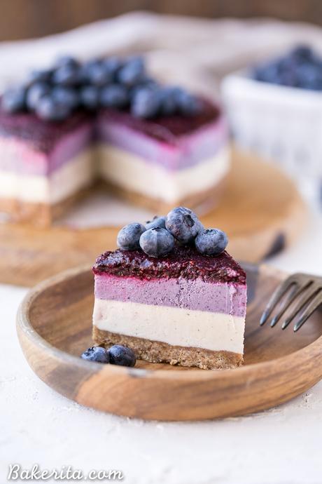 This No-Bake Layered Blueberry Cheesecake is a beautiful and easy-to-make Paleo-friendly + vegan cheesecake made with soaked cashews! The cheesecake layers are lusciously smooth and creamy with a tart, fruity topping.