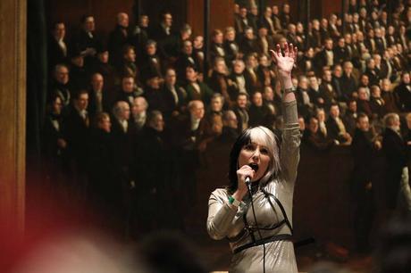 Image may contain: 1 person, standing, crowd and concert