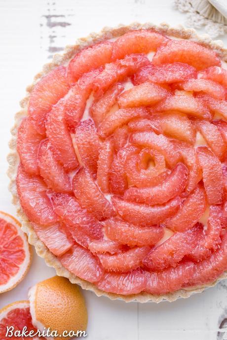 This Grapefruit Tart has a bright, tart grapefruit flavor from the silky grapefruit curd, and it's topped with gorgeous pink grapefruit segments! This gluten-free, Paleo, and refined sugar free tart is a stunning way to show off grapefruit.