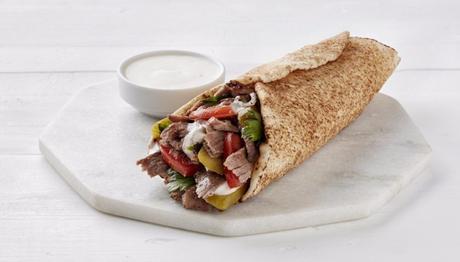 Shawarma is one of the middle eastern foods that you eat as a wrap, with tzatziki sauce on the side