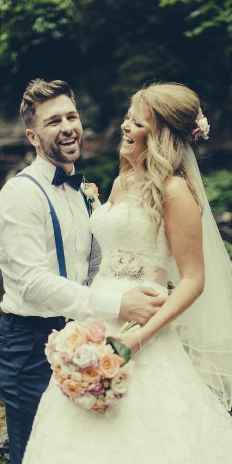 laughing bride and groom photographed by Lottie Designs in Lancashire