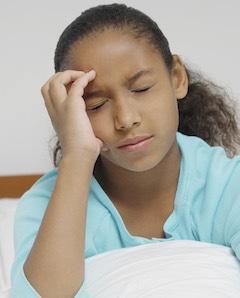 child having migraine