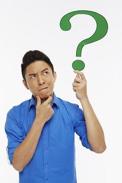 man holding question mark