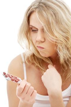 blond anxious over probiotic pills