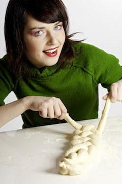 woman shaping dough