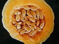 open pumpkin with seeds