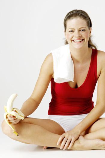 woman having post workout banana