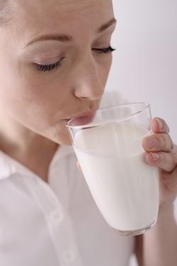 woman drinking glass of milk