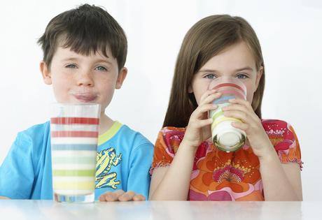 Boy and Girl Drinking Milk