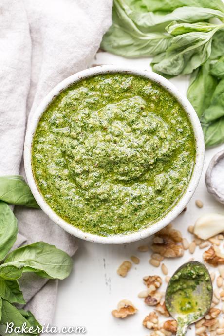 This Spinach Basil Pesto is loaded with bright herby flavor and made in just a few minutes. You won't miss the cheese in this paleo, vegan + Whole30-friendly pesto. It will make any meal more flavorful, whether it's tossed with pasta, enjoyed with your favorite protein, or used as a spread.