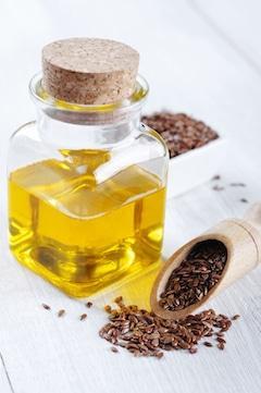 flaxseeds with flaxseed oil bottle