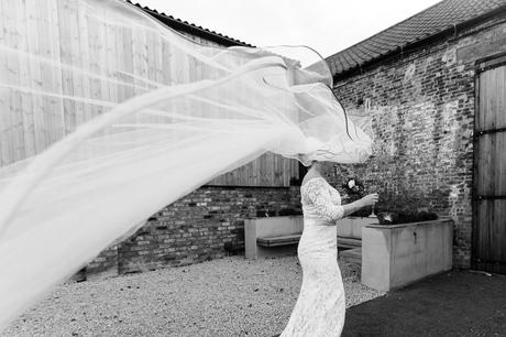 Bride's veil caught int he wind at The Normans in York