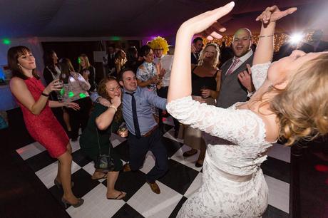 Bride dances with guests and acts silly