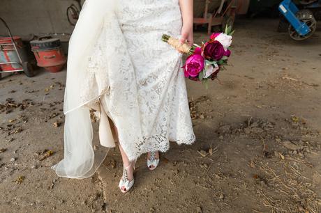 Bride shows lace dress details
