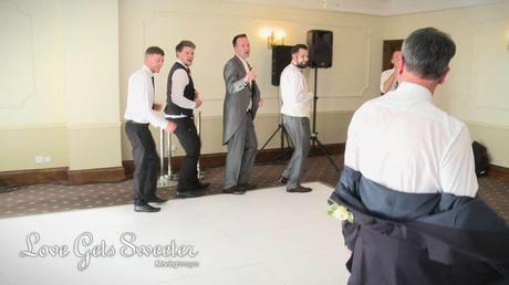 groom and friends dancing in their own boyband during singing waiters surprise perfomance at Willington Hall