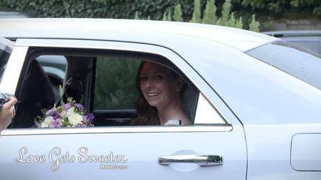 bride sat in her wedding car in the rain typical august wedding weather