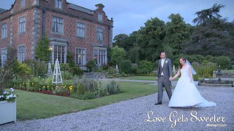 bride and groom taking a romantic walk around the stunning gardens at sunset at willington hall in Cheshire