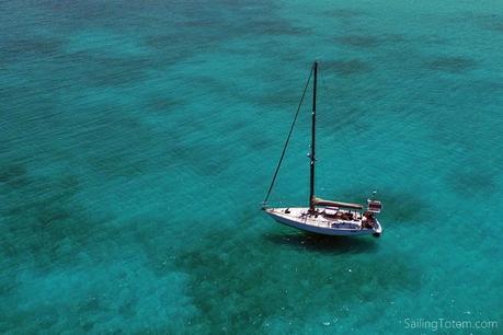 sailboat in clear blue water