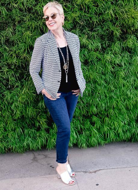 style blogger Susan B. of une femme d'un certain âge wearing a Missoni knit jacket with jeans and metallic sandals