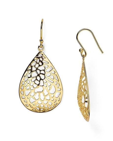Bold earrings with open lace design will be lighter and more comfortable. Details at une femme d'un certain age.