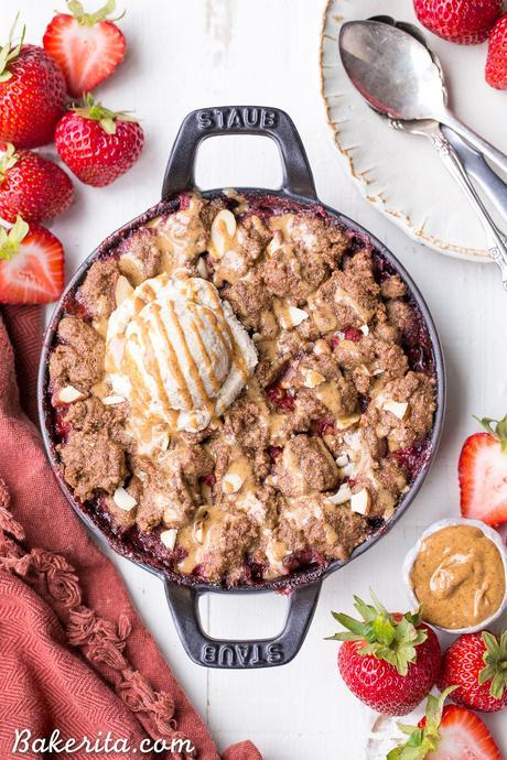 This Strawberry Crisp with Almond Butter Crumble is an irresistible pairing of fresh strawberries and a lightly-sweetened, rich and crispy almond butter cookie crumble. You won't be able to resist this gluten-free, paleo, and vegan dessert.