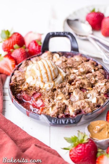 This Strawberry Crisp with Almond Butter Crumble is an irresistible pairing of fresh strawberries and a lightly-sweetened, rich and crispy almond butter cookie crumble. You won't be able to resist this gluten-free, paleo, and vegan dessert.