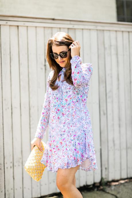Amy Havins wears a Shoshanna floral print summer dress.