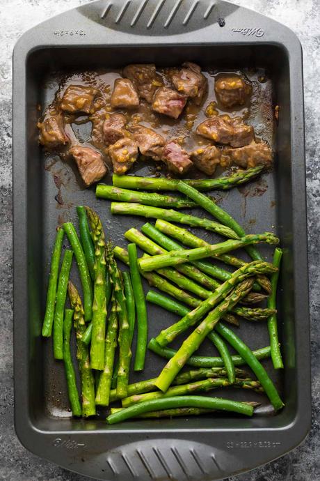 Prep this Hoisin Ginger Steak along with the asparagus & green beans ahead of time for a ridiculously easy dinner! Tips for making it in the oven or on the grill.