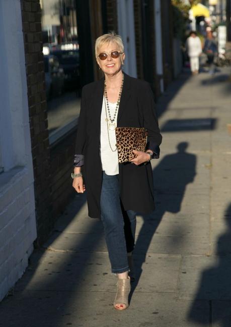 casual outfit with navy jacket, jeans and leopard bag