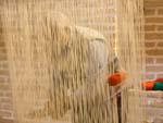 Man making traditional nomad carpet