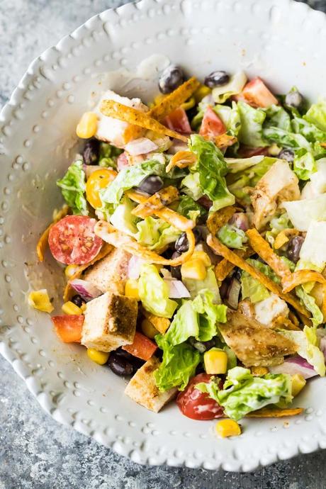 This southwestern chopped chicken salad is going to be your new favorite work lunch! Prep ahead on the weekend and when you're ready to serve, drizzle with ranch and sprinkle with tortilla strips.