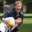 Try Not to Smile While Looking Through All These Adorable Photos of Prince Harry With Kids, Dogs and His Family