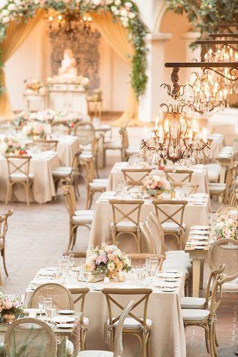 wedding reception decorations in elegant style in beige tones with beautiful chandeliers and flowers on tables studio emp photography